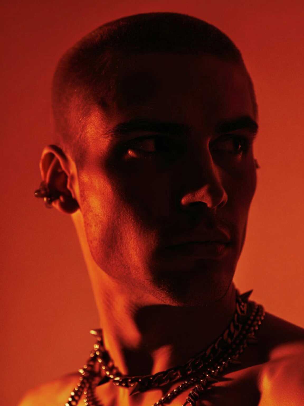 nightclub-exit style shot of Damon Cael in luminous fashion details, rising pop artist Damon Cael.