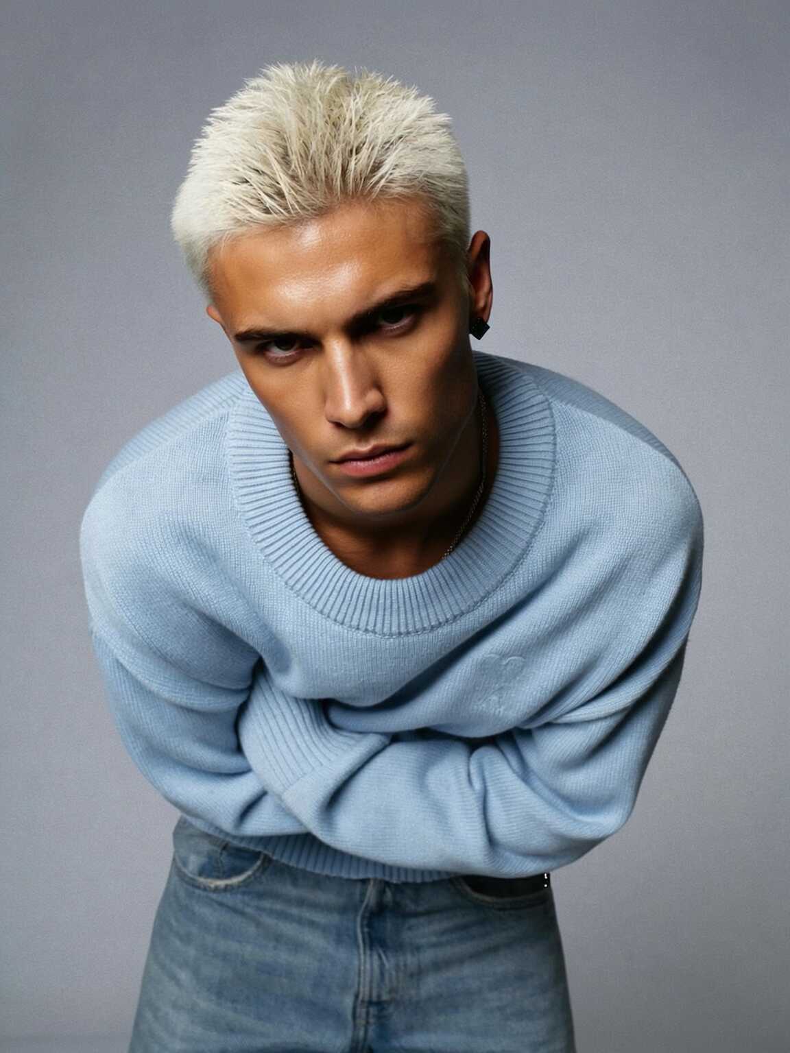 car-park candid of Damon Cael in dark tailored ensemble, rising pop artist Damon Cael.