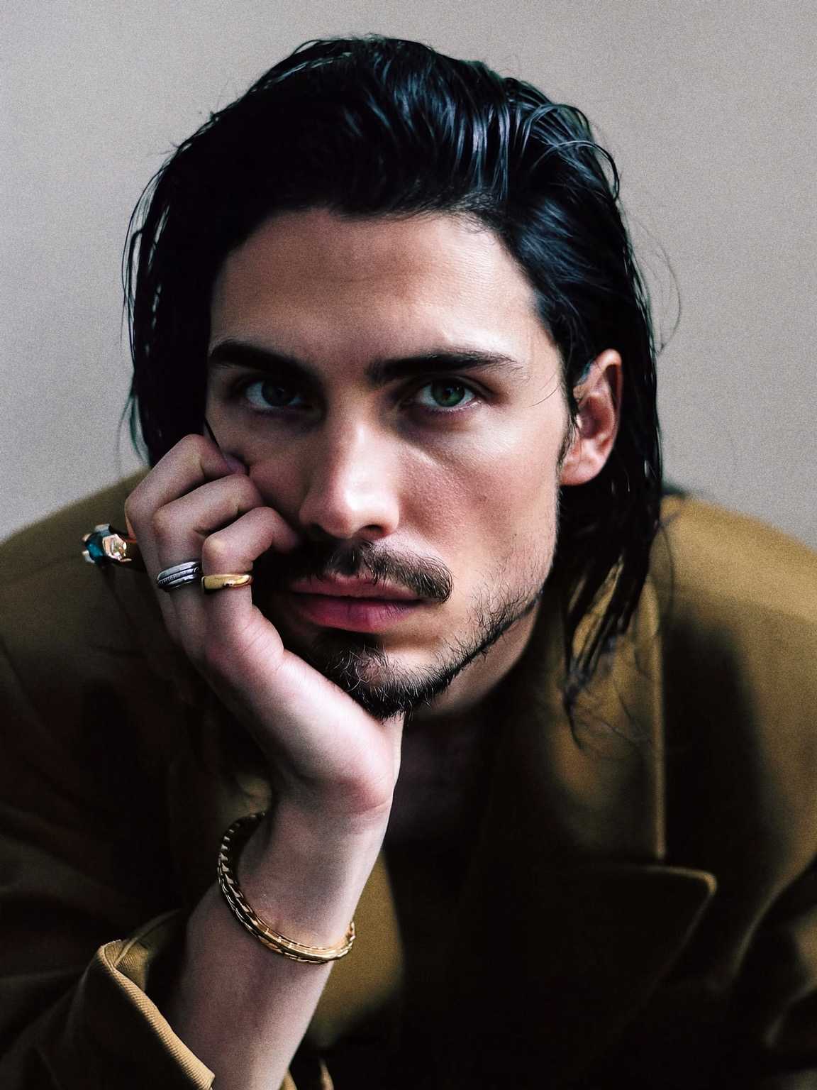 paparazzi-style hallway photo of Damon Cael leaving a venue, rising pop artist Damon Cael.